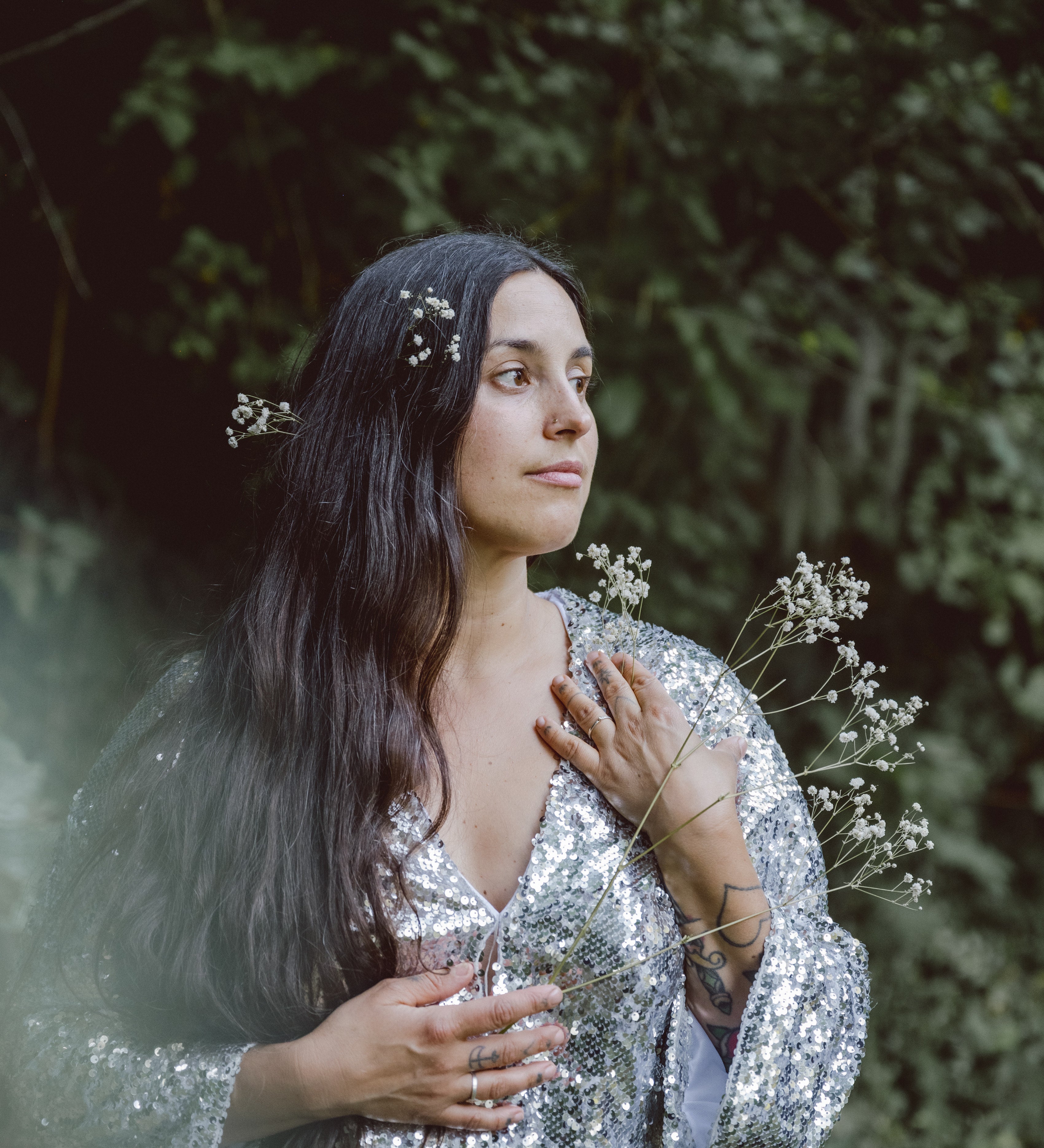 Stephanie Artuso, Photographer for FOLKLIFE stands in the forest